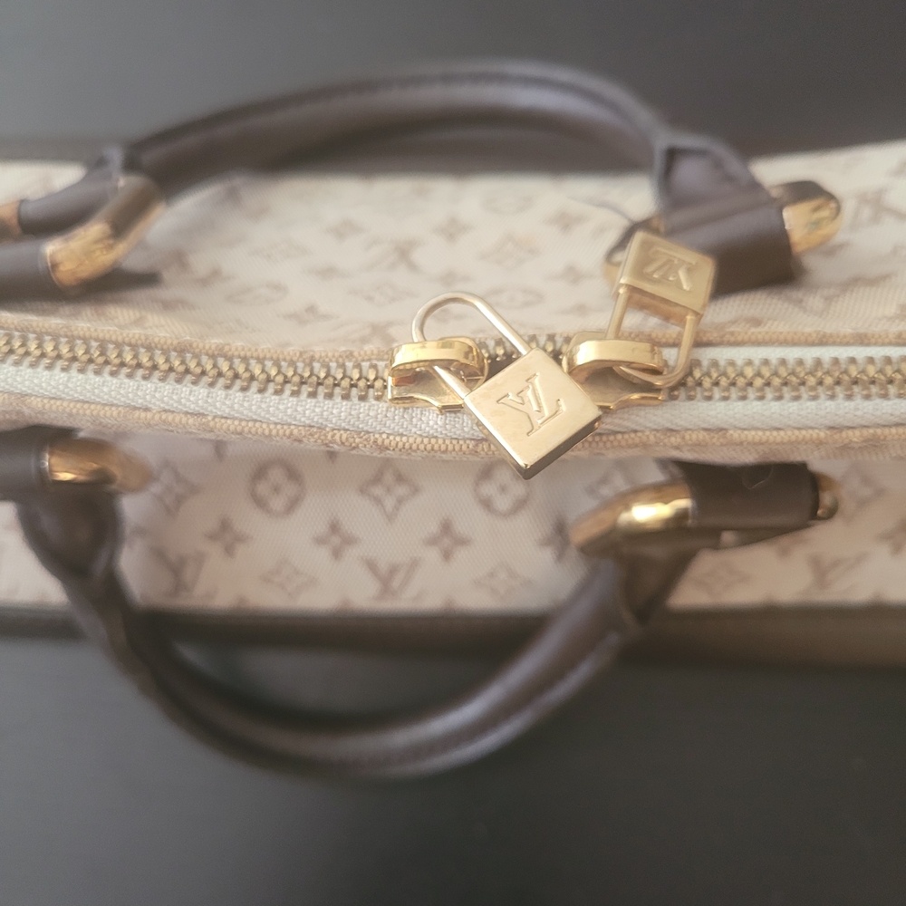 Louis Vuitton Black & Ecru Fabric Canvas. Logo Mini. Firm Price